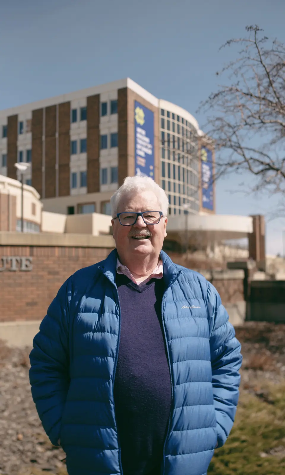 photo of man smiling in front of the Cross Cancer Institute in Edmonton Reply